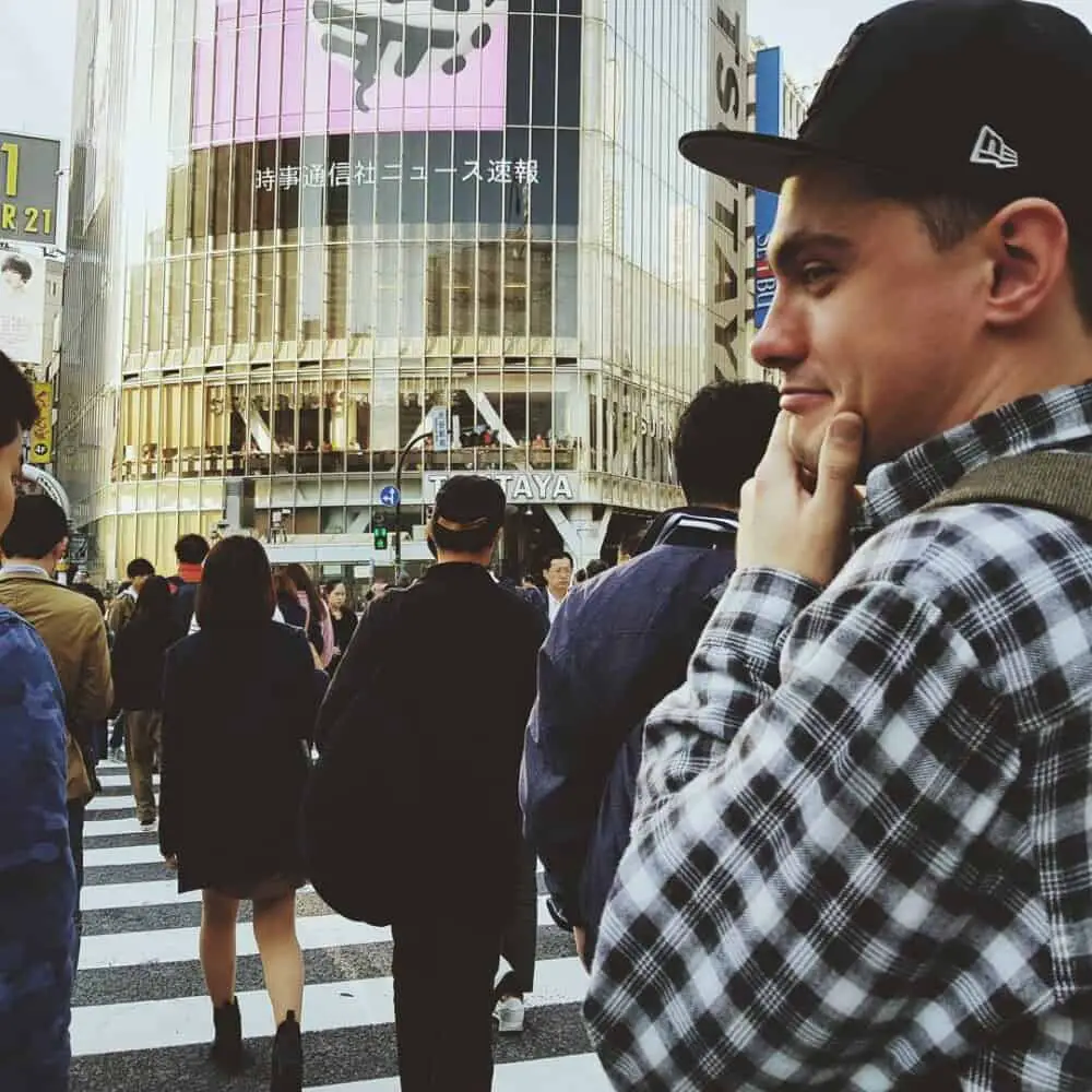 man walking on Shibuya crossing, scramble crossing